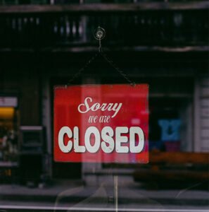 Shop showing a Sorry We Are Closed Sign